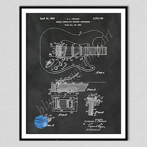 Puede incluir: Impresi&oacute;n enmarcada en negro de una ilustraci&oacute;n de patente de guitarra Fender. El diagrama muestra el dispositivo de tr&eacute;molo para instrumentos el&eacute;ctricos, con dibujos y texto detallados. La impresi&oacute;n incluye la fecha 10 de abril de 1956 y el nombre del inventor.