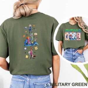 May include: Military green t-shirt with a vibrant graphic from "Zootopia 2". The design showcases characters such as Judy Hopps and Nick Wilde. This casual t-shirt is suitable for everyday wear.