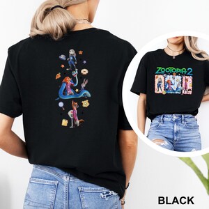 May include: Black t-shirt with a Zootopia 2 movie graphic. The front displays the title and characters, while the back has a vertical design with characters and icons. A fun, colourful design.