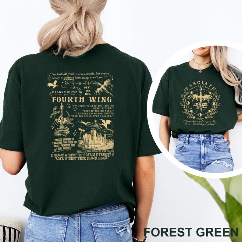 May include: Forest green t-shirts with graphic designs. One shirt features text and illustrations related to "Fourth Wing" and "Dragon Rider." The other shirt displays a circular design with the text "Basgiath War College."