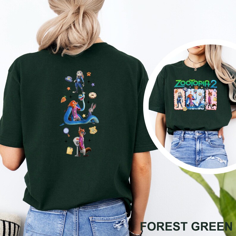May include: Forest green t-shirt with a Zootopia 2 graphic. The back of the shirt has a vertical design with cartoon characters. The front of the shirt has the movie title and characters in a rectangular design.