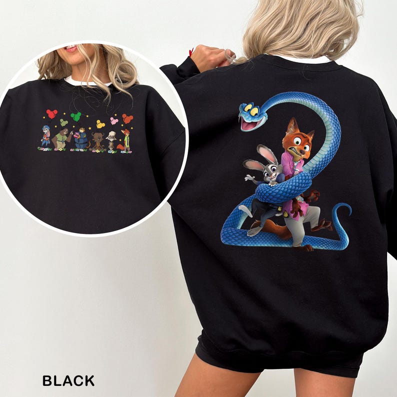 May include: Black sweatshirt featuring colorful cartoon characters on the front and a blue snake wrapped around a fox and bunny on the back. The sweatshirt has a white collar and the word "BLACK" is printed at the bottom.