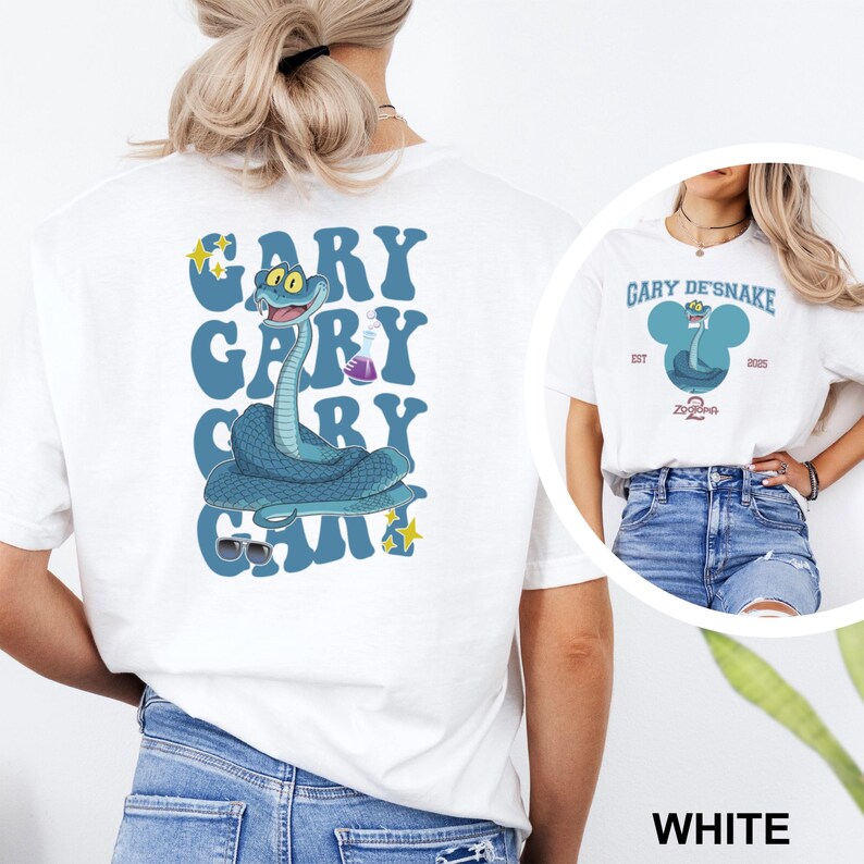 May include: White t-shirt featuring a cartoon snake design with the text "GARY" in blue bubble letters. The snake is blue with a lab flask and sunglasses. A smaller image shows a similar design with the text "GARY DE'SNAKE".