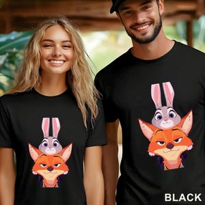 May include: Black t-shirts featuring a cartoon image of a fox with a bunny on top. The fox is orange and the bunny is gray with pink ears. The word "BLACK" is printed in white at the bottom of the image.