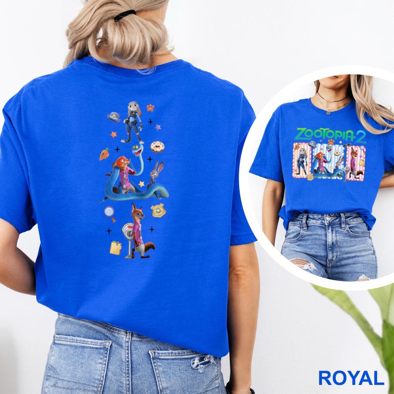 May include: Royal blue t-shirt with a colourful graphic of "Zootopia" characters on the front and back. The back graphic features Judy Hopps, Nick Wilde, and other characters. The front graphic says "Zootopia 2".