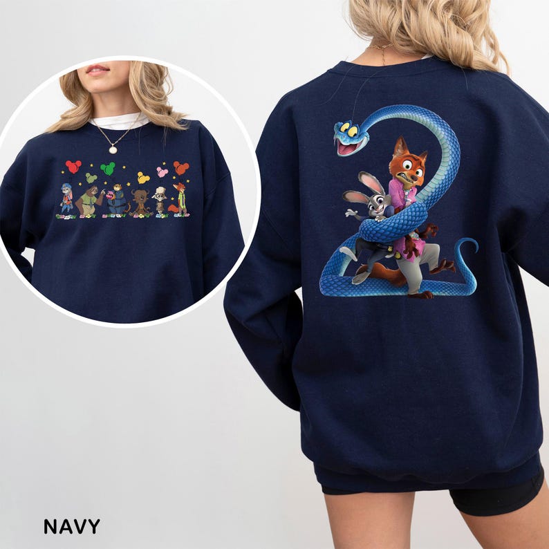May include: A navy blue sweatshirt featuring a graphic on the back of a large blue snake coiled around a fox and a rabbit character. The front chest area displays a smaller horizontal row of various animated characters with colorful mouse-ear icons.