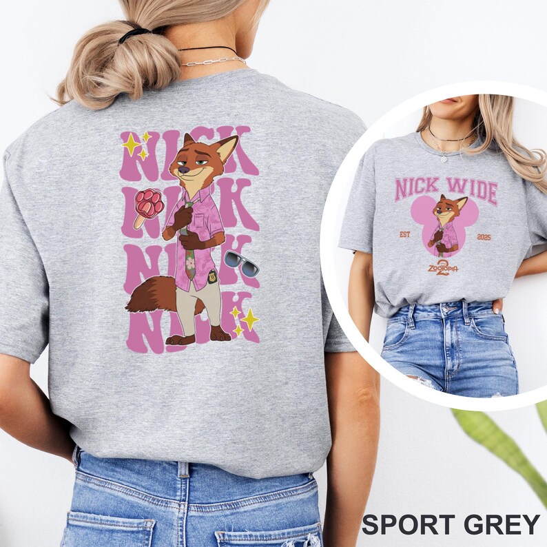 May include: Sport grey t-shirt featuring a cartoon fox character in a pink shirt and sunglasses. The back of the shirt has the name "NICK" in a pink, stylized font. The front of the shirt has the text "NICK WIDE" with a fox character and the text "Zootopia 2".