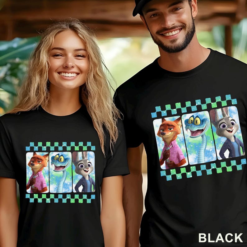 May include: Black t-shirts featuring a colorful graphic of three cartoon characters in a film strip design. The characters include a fox, a snake, and a rabbit. The word "BLACK" is printed at the bottom of the shirt.