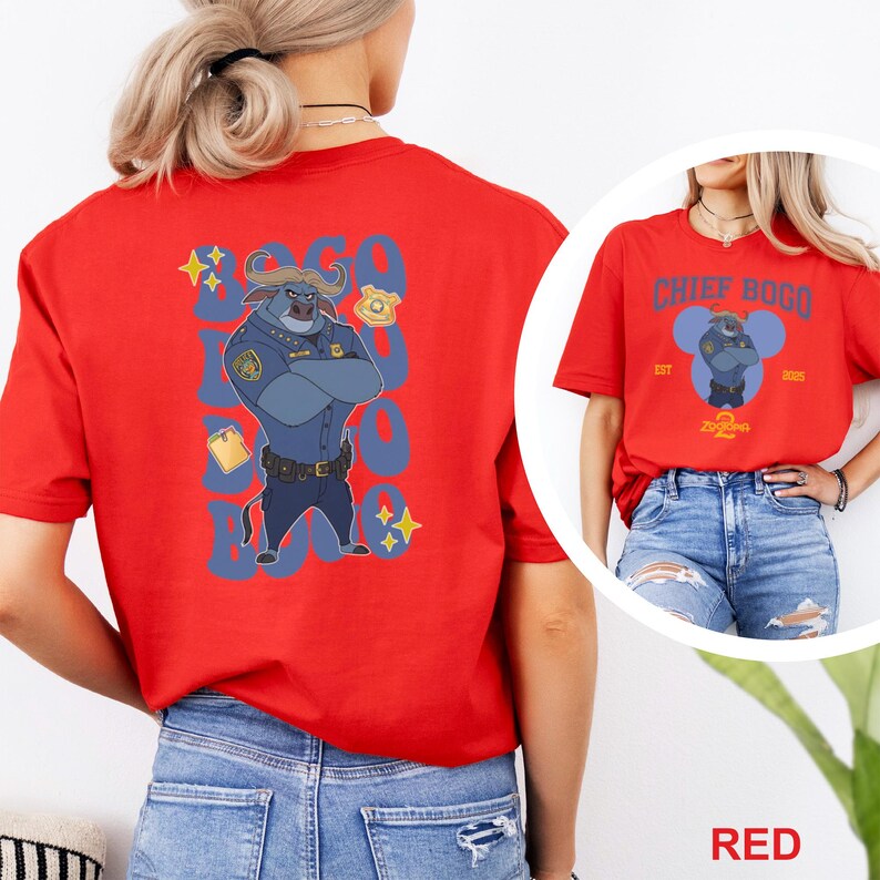 May include: Red t-shirt featuring a cartoon illustration of Chief Bogo from Zootopia. The design includes the text "CHIEF BOGO" and "Zootopia" with the years "EST 2015". The back of the shirt has a larger image of Chief Bogo.