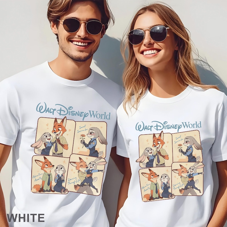 May include: White t-shirts featuring a cartoon graphic of Zootopia characters. The shirts have the text "Walt Disney World" in light blue. The graphic shows Nick Wilde and Judy Hopps in various poses. The word "WHITE" is at the bottom.