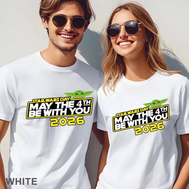 May include: White t-shirts with a Star Wars Day graphic featuring the text "MAY THE 4TH BE WITH YOU 2026" and a green character. The word "WHITE" is at the bottom of the shirt.