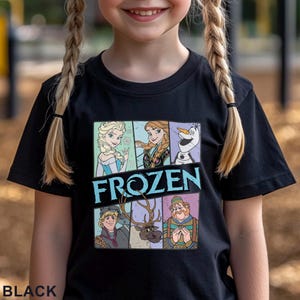 May include: Black t-shirt featuring a colorful graphic of characters from the movie "Frozen." The design includes Elsa, Anna, Olaf, Kristoff, Sven, and a man in a hat. The word "FROZEN" is printed in large, light blue letters. The word "BLACK" is printed at the bottom.