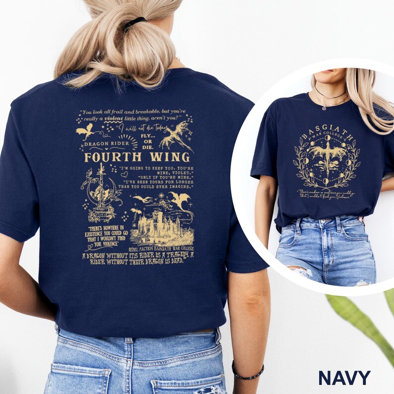 May include: Navy blue t-shirts with graphic designs. One shirt features the text "FOURTH WING" with dragon illustrations and quotes. The other shirt displays "BASGIATH WAR COLLEGE" with a dragon and moon phases.