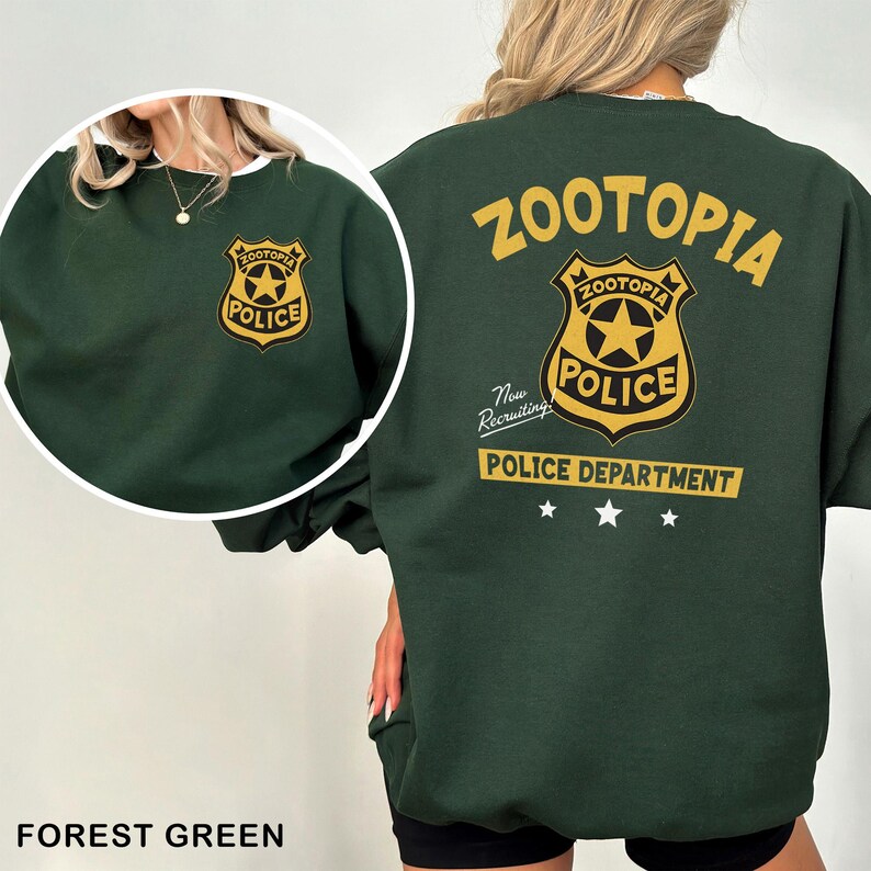 May include: Forest green sweatshirt featuring the Zootopia Police Department logo on the front and back. The back design includes the word "Zootopia" above the badge, and "Police Department" below, with three stars.