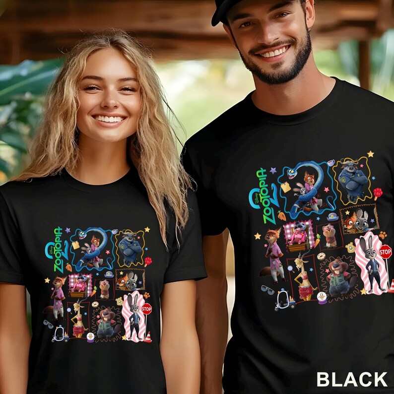 May include: Black t-shirts featuring a colorful graphic design from the movie Zootopia. The design includes various characters and the word "Zootopia" in a stylized font. The text "BLACK" is printed at the bottom.