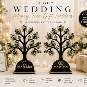May include: Set of two black wedding money tree gift holders. Each tree-shaped holder features a base with "Mr & Mrs" and holds cash or gift cards. The image includes text that reads "A beautiful way to gift cash."
