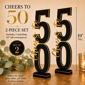May include: A two-piece set of black and gold centerpieces, each featuring the number 50 and the text Cheers to in gold script. These decorative items stand 19 inches tall and are designed as matching vertical displays for party tables.