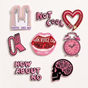 May include: A selection of embroidered patches in various shapes and designs. Includes a patch with the text "POSITIVE VIBES ONLY", a pink heart-shaped pencil, and a skull with the words "WHERE IS MY MIND?". Other patches feature phrases like "NOT COOL" and "HOW ABOUT NO".