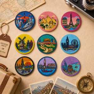 May include: Nine circular embroidered patches featuring global landmarks including the Tokyo Tower, Egyptian pyramids, Eiffel Tower, a Dutch windmill, the Great Wall of China, Big Ben, a Thai temple, a Venetian canal, and a San Francisco cable car.