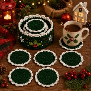 May include: A set of round, dark green crochet coasters with white scalloped edges, accompanied by a matching circular crochet storage basket featuring white snowflake embroidery and a central holly berry motif, plus a ceramic mug with holly art.