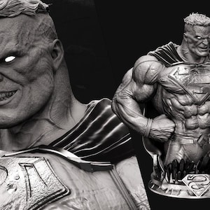 May include: A grayscale sculpture of a muscular superhero with a stern expression and glowing eyes. The figure wears a cape and a chest emblem. The sculpture is on a pedestal with a logo.