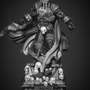 May include: A black and white statue of a superhero figure, standing on a base covered in skulls. The figure wears armor, a cape, and a belt with a skull buckle. The Superman logo is visible on the chest.