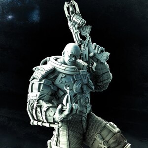 May include: A detailed, gray-toned figurine of a bald, muscular character in futuristic armor, holding a large weapon. The figure wears round glasses and has a stern expression. The background is dark, emphasizing the figure's intricate design.