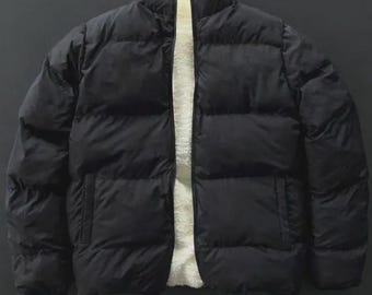 Vändbar vinterjacka i täckkvalitet med sherpafoder