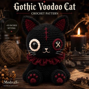 May include: A black crochet cat doll with a red ruffled collar, one white-rimmed eye, one red button eye, and a red stitched forehead mark. The cat has red paw pads and measures approximately 6 inches tall when sitting. Text reads Gothic Voodoo Cat.
