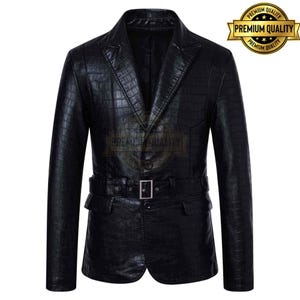 May include: A black leather blazer with a textured, crocodile-like pattern. The blazer features a notched lapel, a single-button closure, and a belt at the waist with a silver buckle. A gold "Premium Quality" seal is in the upper right corner.