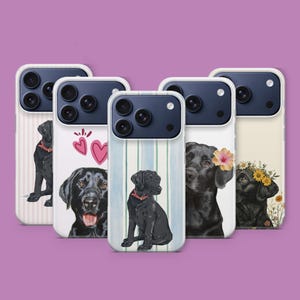 May include: Five phone cases showcasing watercolour illustrations of black Labradors. Designs include striped backgrounds, hearts, and floral details. The dogs are shown in different poses, each case with a unique aesthetic. The cases have a white border.