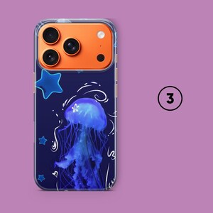 May include: Clear phone case with a dark blue background featuring a blue jellyfish design, blue stars, and white swirls. The phone case has an orange camera module and the number "3" in a white circle.