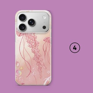 May include: A clear phone case featuring a pink jellyfish design with bubbles and stars. The case has a soft pink background and a clear border. The phone case is shown on a purple background with the number 4 in a circle.