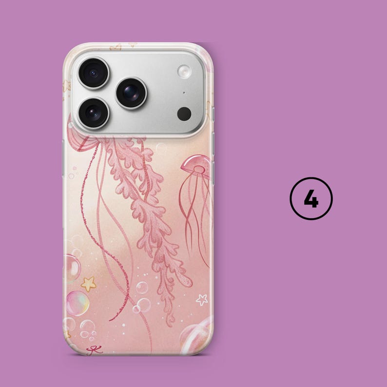 May include: A clear phone case featuring a pink jellyfish design with bubbles and stars. The case has a soft pink background and a clear border. The phone case is shown on a purple background with the number 4 in a circle.