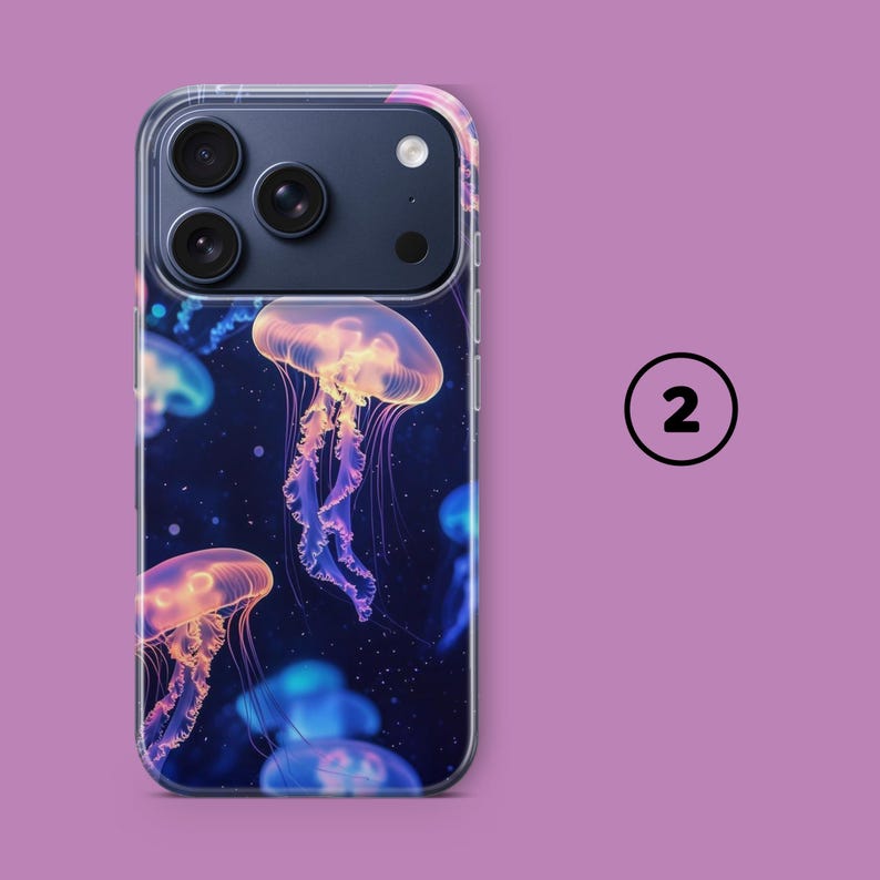 May include: A clear phone case featuring a vibrant design of glowing jellyfish in shades of orange, pink, and blue against a dark blue background. The case has a clear border and a camera cutout. The number 2 is in a black circle on a purple background.