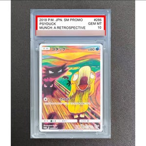 May include: A 2018 P.M. JPN. SM PROMO #286 Psyduck Munch: A Retrospective trading card in a clear protective slab. The card features a yellow Psyduck character with a wide-open mouth, two dark figures, and a colorful, swirling background.