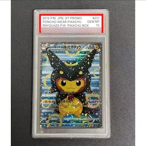 May include: A 2016 Japanese Pokemon trading card featuring Pikachu wearing a black Rayquaza poncho, encased in a clear protective slab. The label reads 2016 P.M. JPN. XY PROMO #231 PONCHO-WEAR.PIKACHU GEM MT RAYQUAZA P.W. PIKACHU BOX 10.