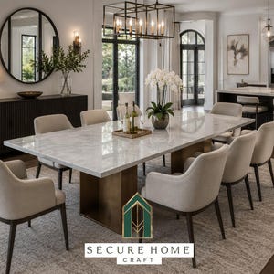 May include: A dining room featuring a rectangular marble table with a brass pedestal base, surrounded by eight upholstered beige chairs with dark wood legs. A large round mirror hangs above a dark sideboard, and a rectangular chandelier hangs above.