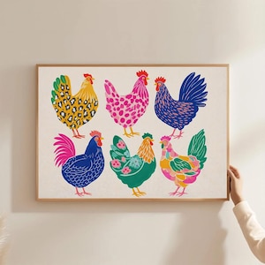 May include: A framed art print featuring a collection of six colorful rooster illustrations. Each rooster is depicted in a unique pattern and color scheme, including yellow with leopard spots, pink polka dots, and blue with textured details.