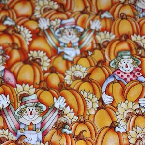 May include: A fabric pattern featuring a repeating design of orange pumpkins, sunflowers, and smiling scarecrows. The scarecrows are depicted with straw hair, hats, and overalls, adding a whimsical touch to the autumn-themed print. The pumpkins vary in size and shape.