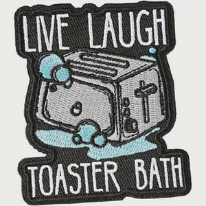 May include: Embroidered patch with the words "LIVE LAUGH" above a cartoon toaster in a bath of bubbles, and the words "TOASTER BATH" below. The patch has a black border and white text.