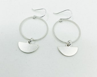 Silver hoops and charm earrings