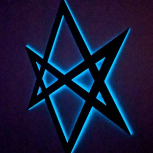 May include: A black, geometric star design with a bright blue neon glow. The star is composed of intersecting lines, creating a multi-pointed shape against a dark purple background. The neon light outlines the star's edges.
