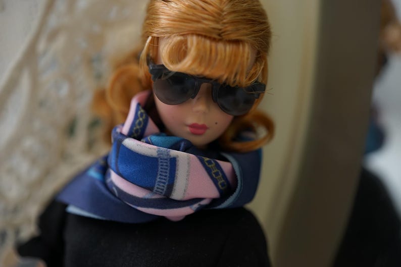 Vintage Hollywood-inspired 1/6 doll styling with sunglasses and a patterned scarf