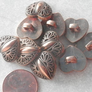 Small acrylic heart shaped metal look buttons in bronze New Old Stock