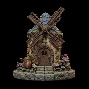 May include: A whimsical miniature windmill with a stone base, adorned with flowers and foliage. The structure features a wooden door, a blue-tiled roof, and wooden windmill blades. A small jar sits to the side, adding to the fairy tale aesthetic.