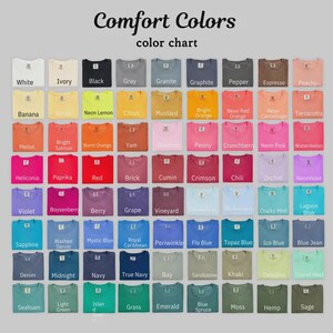May include: A color chart displaying a variety of t-shirt colors. The chart includes shades like white, black, gray, and vibrant hues such as neon orange, pink, and green. The text "Comfort Colors" and "color chart" are at the top.