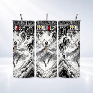 May include: Three stainless steel tumblers with a One Piece anime design. Each tumbler features a character in a white robe against a black and white background with Japanese text. The tumblers have a straw.