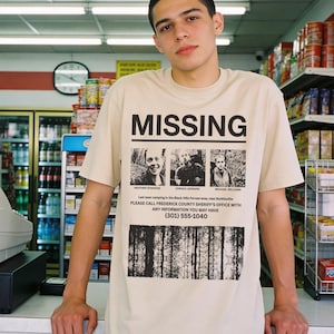 Retro The Blair Witch Project Movie t-shirt with grunge Missing Poster on a unisex beige and black graphic tee for 90s horror movie fans