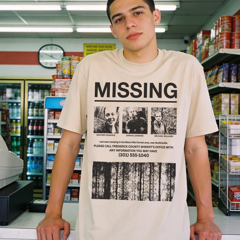 Retro The Blair Witch Project Movie t-shirt with grunge Missing Poster on a unisex beige and black graphic tee for 90s horror movie fans